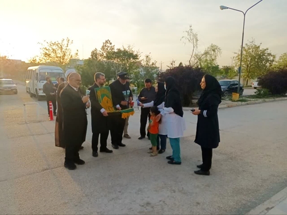 حضور پرچم متبرک بارگاه منوّر حضرت علی بن موسی‌الرضا علیه‌السلام در بیمارستان امام حسن مجتبی(ع) فامنین